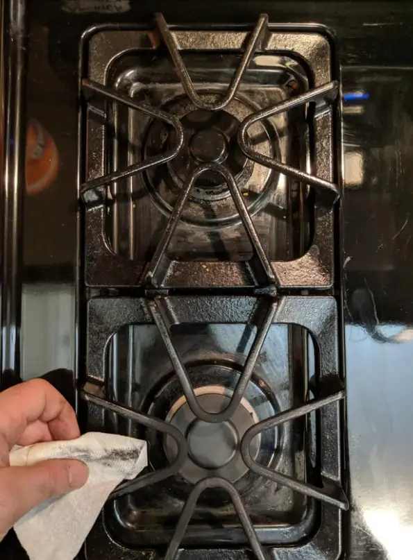 stovetop grates being getting cleaned